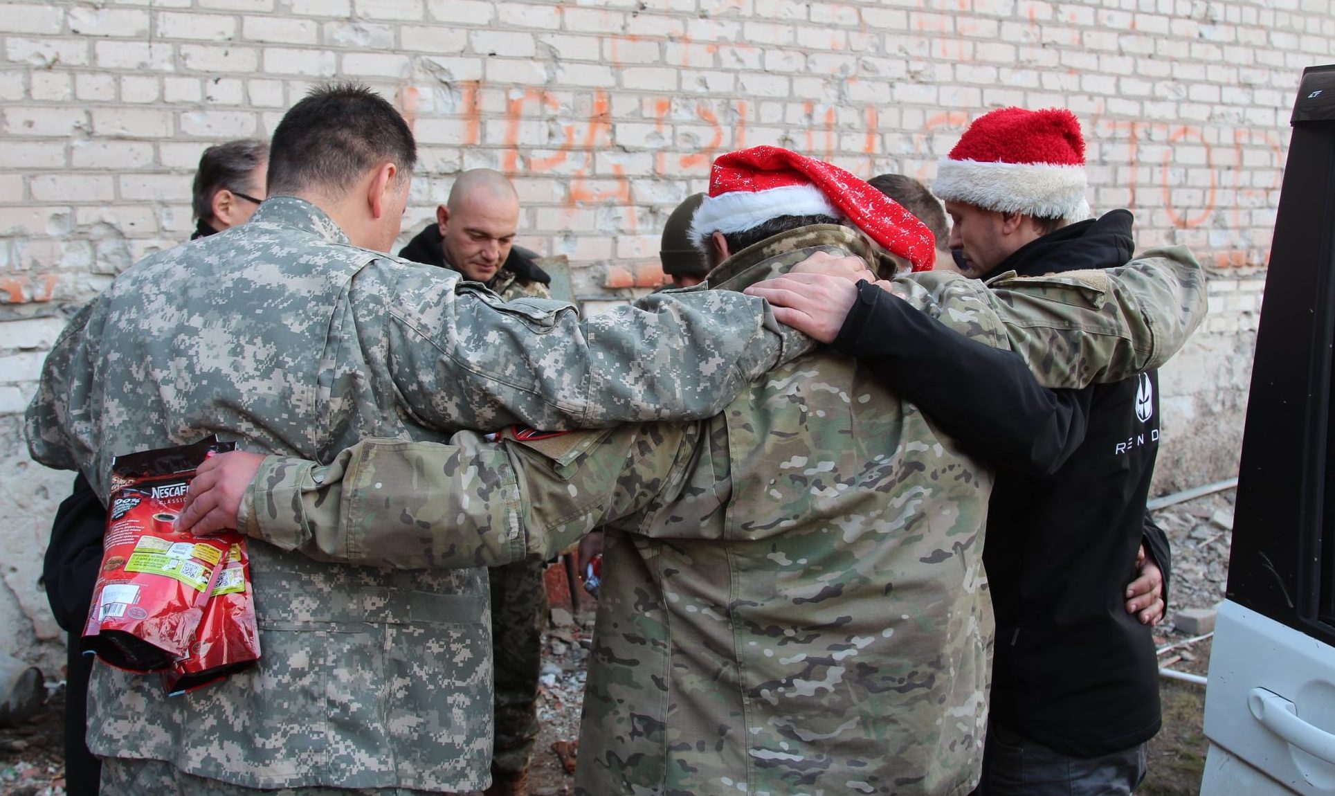 Ukrainian soldiers pray for God's favor.