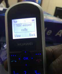 The digital readout on one phone shows 1697 missed calls. There are 14 more phones with similar calls waiting.