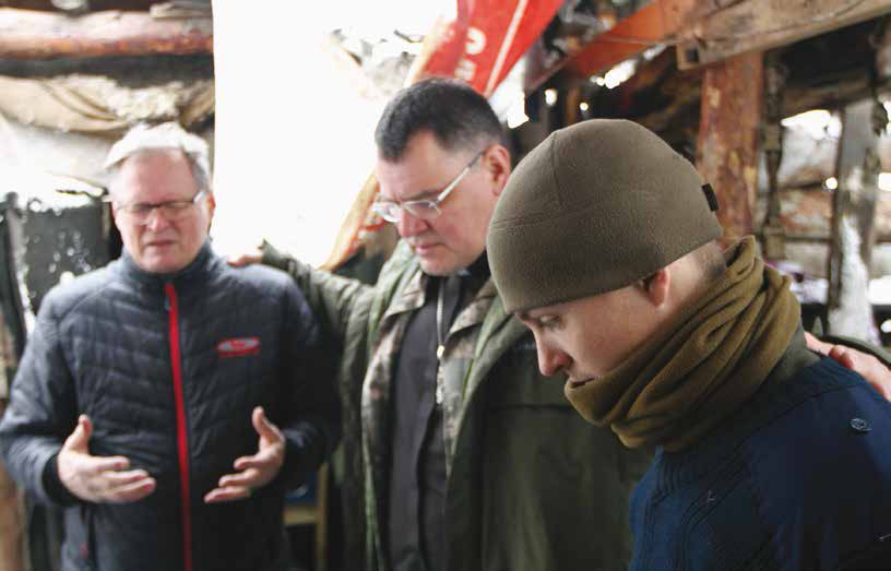 Military chaplain Gennady and Hannu pray with soldiers in a bunker in the war-zone. Gennady is pastor of the largest church in Mariupol. He also manages the Mariupol orphanage and children’s home and facility for the disabled elderly. GCM Ministries financed a broiler farm for the children and adults in the war-zone, on a regular basis providing broilers to those in these shelters.