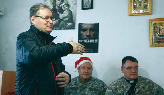 Hannu ministering in a worship service in the town of Pavlopol. The surrounding area is under artillery fire on a daily basis.