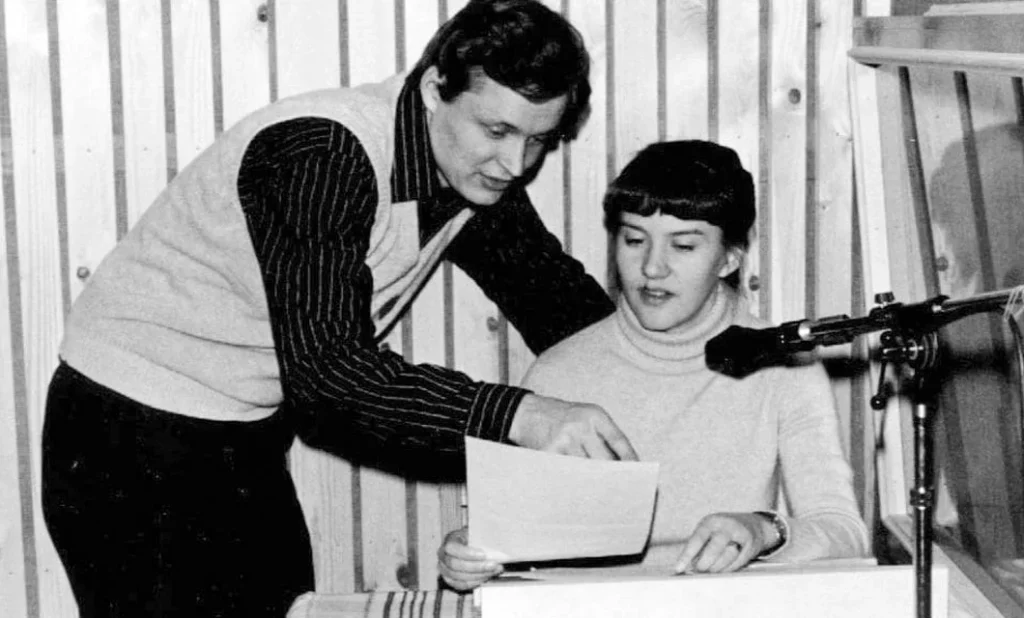 Hannu and Laura Haukka reviewing a script together at an early home radio studio microphone